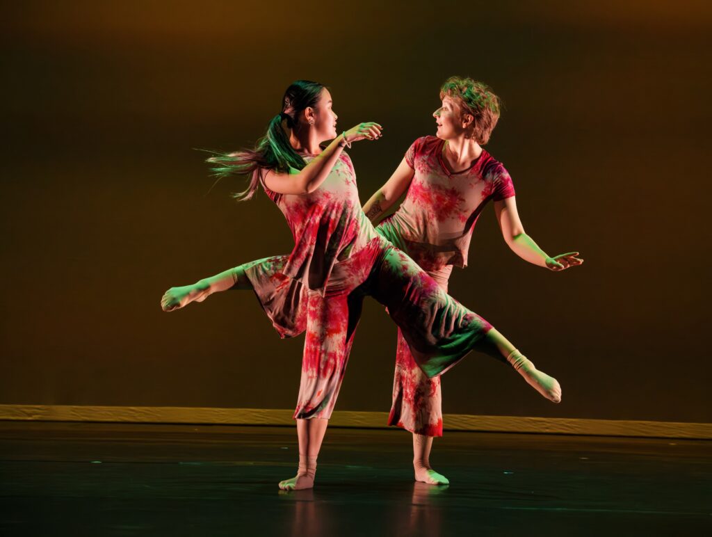 Two dancers look at each other